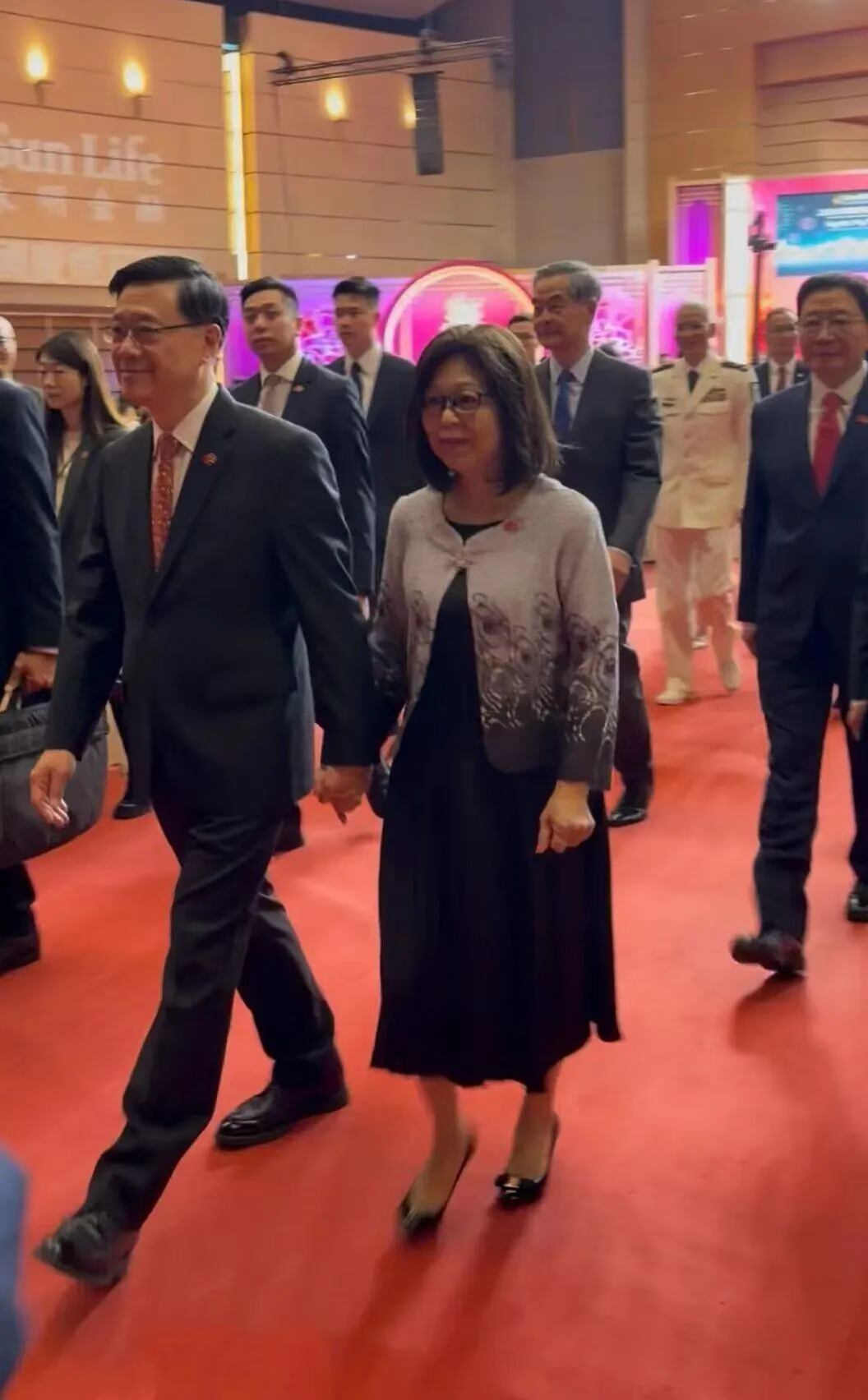 Mr John Lee, Chief Executive of the Hong Kong SAR, and his wife arrive at the reception.