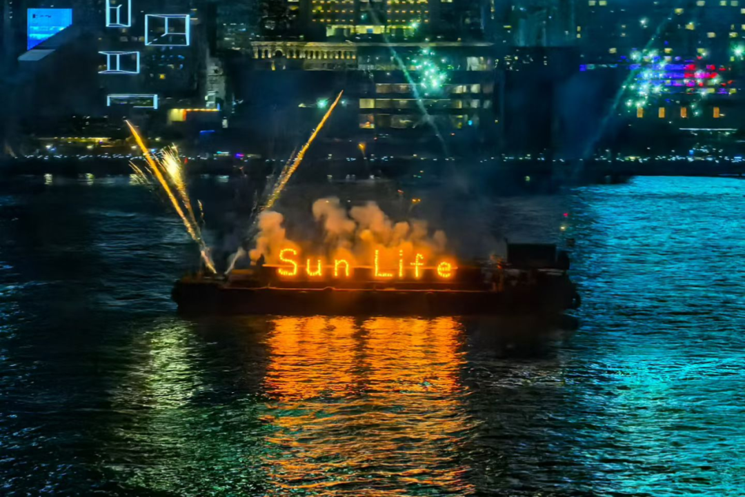 Sun Life lettering in fireworks over the harbour